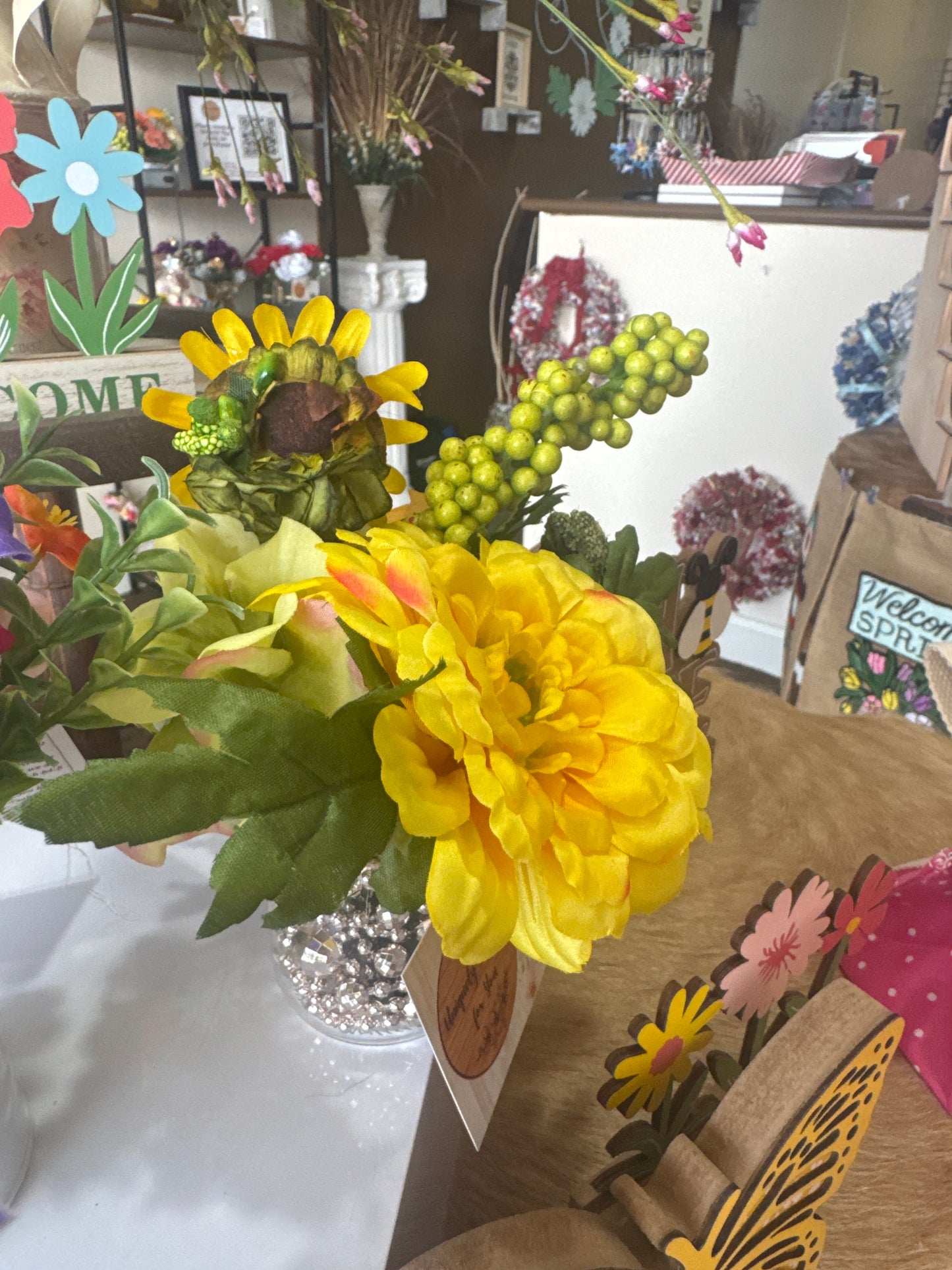 Yellow florals in jar with beads