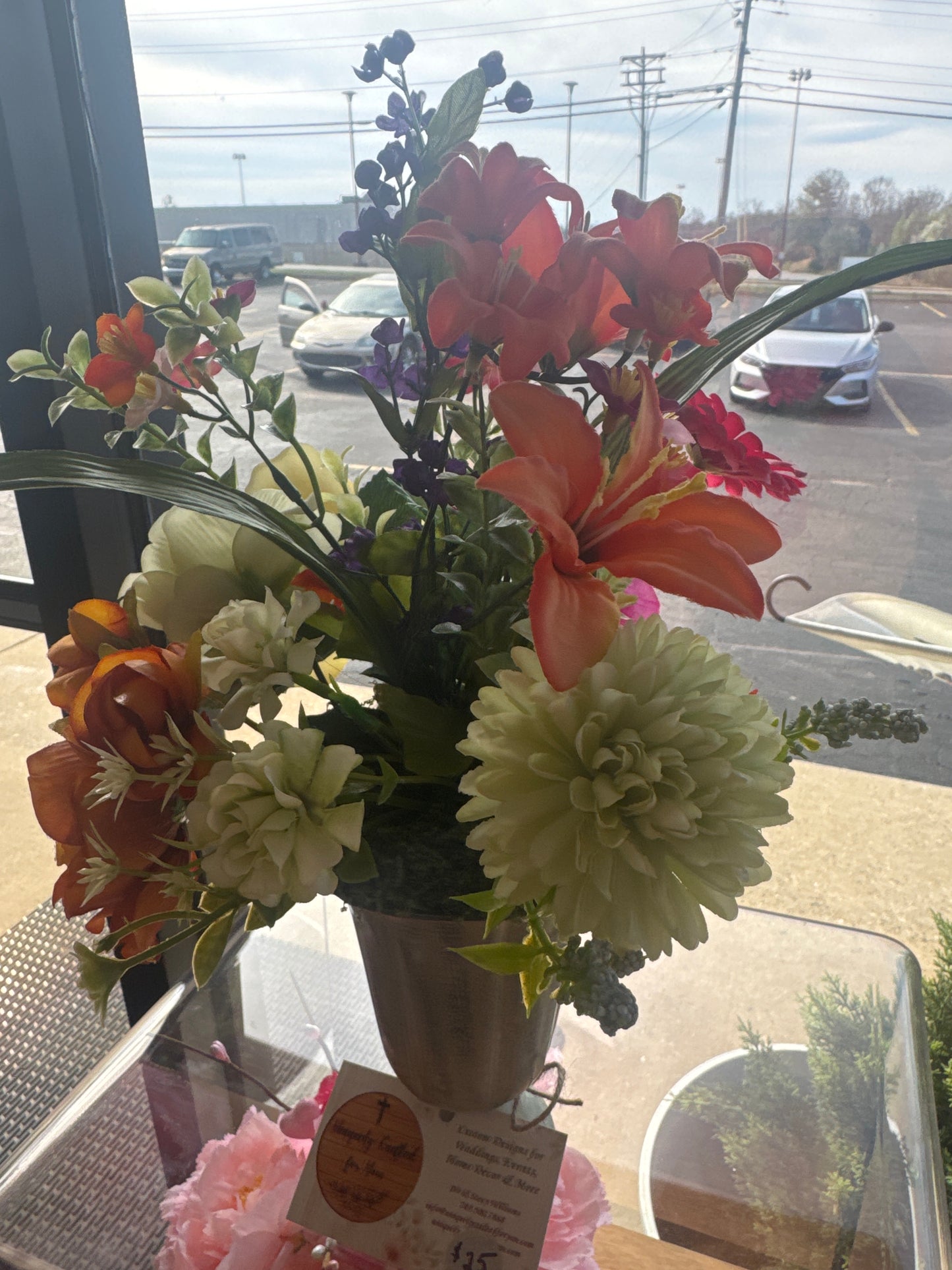 White antiqued vase with spring florals