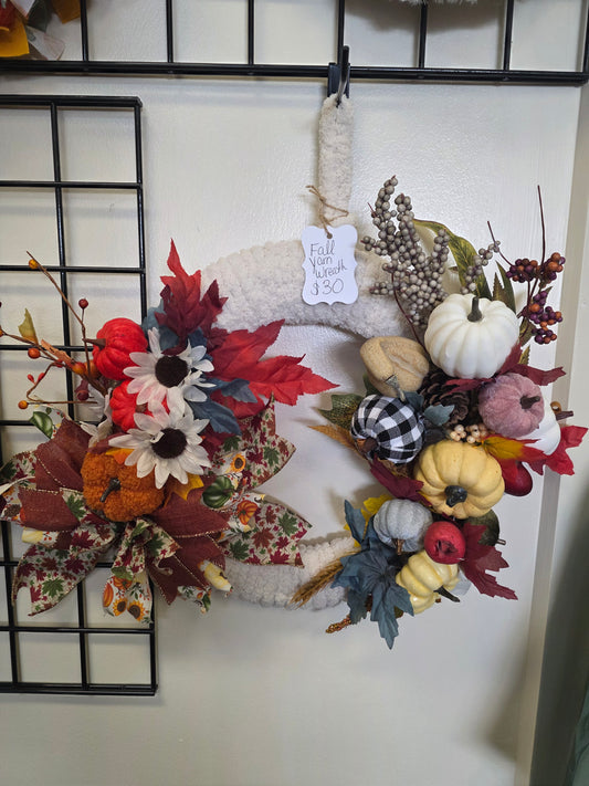 Fall yarn wreath with pumpkins
