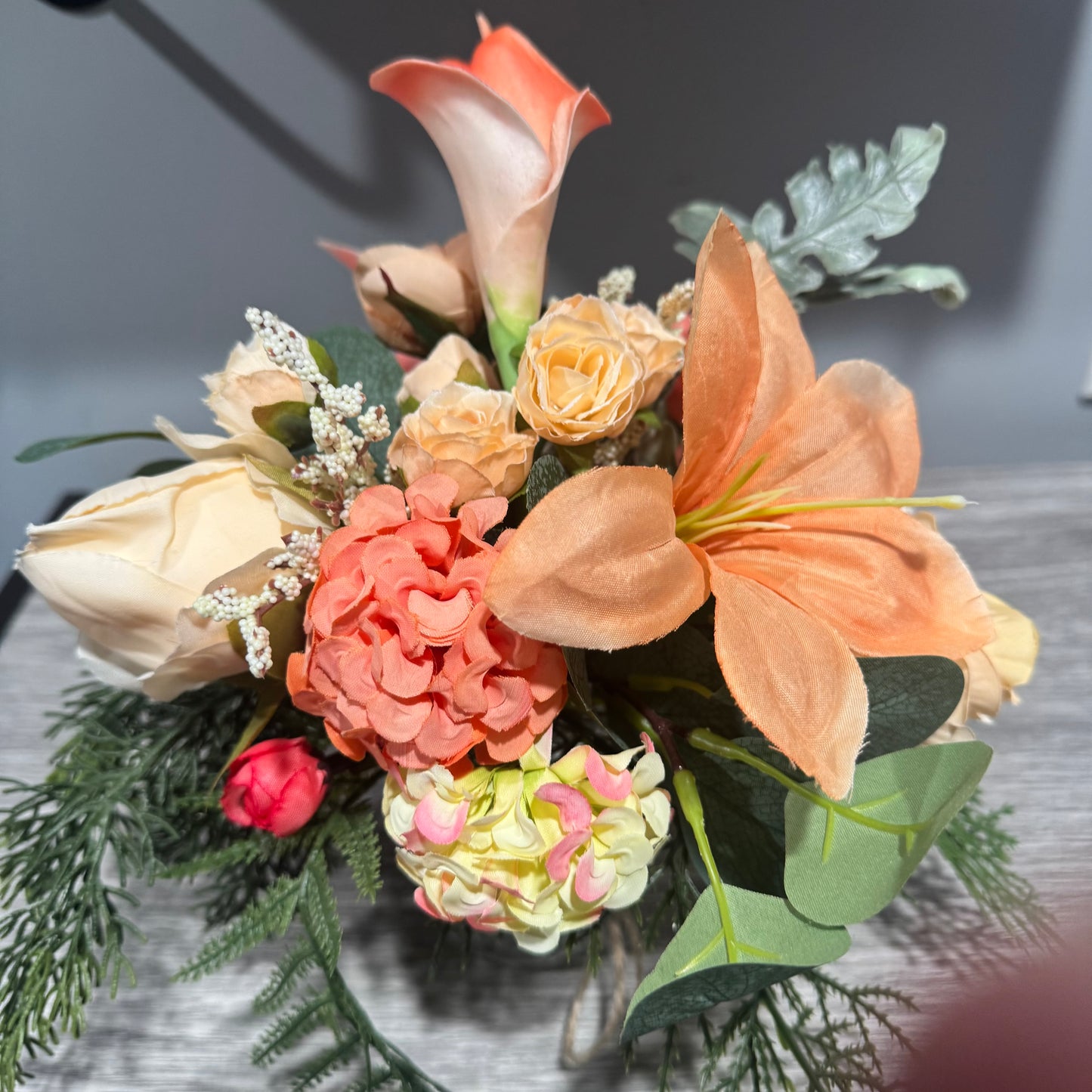 Glass jar with coral flowers
