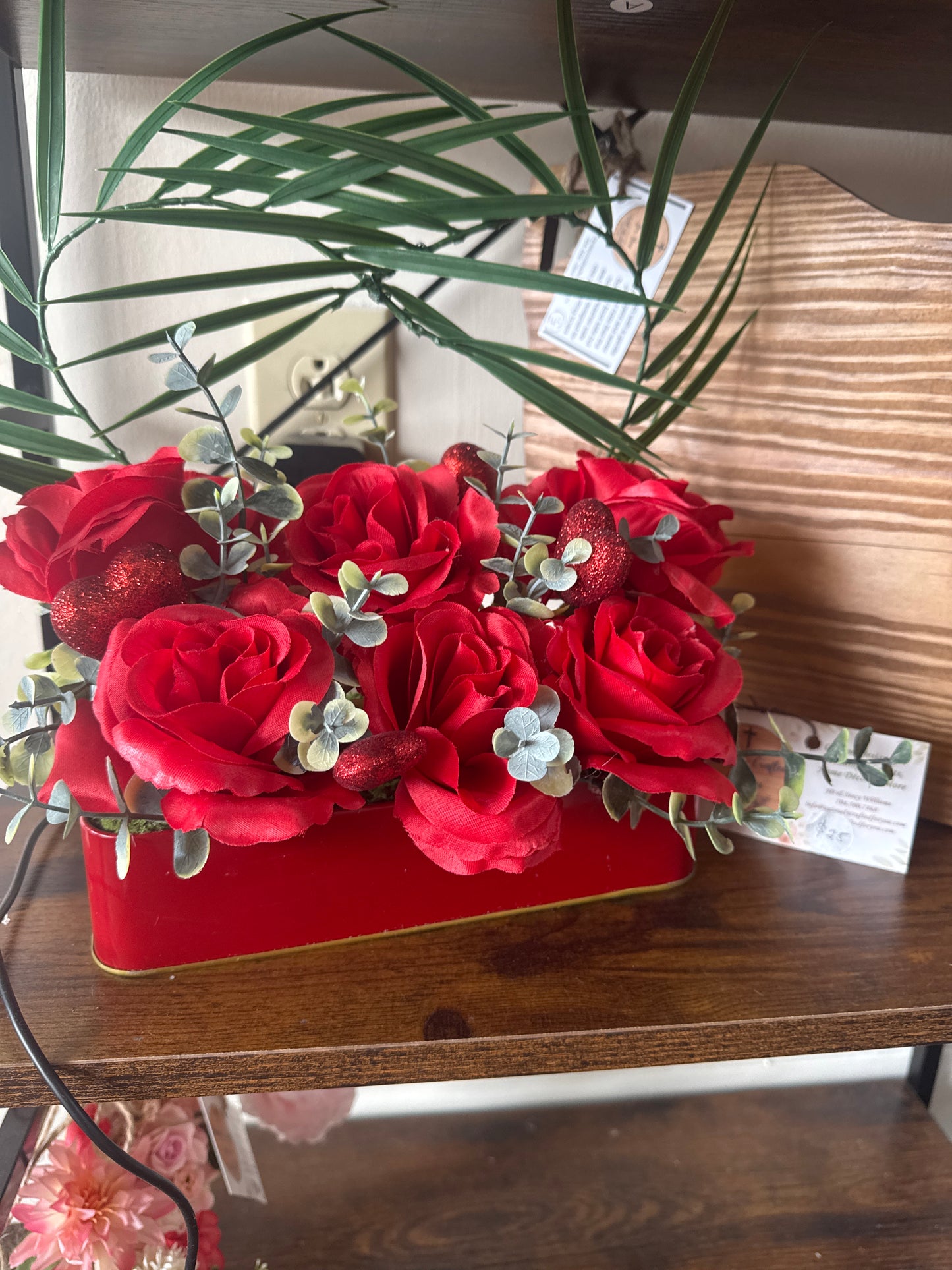 Red and white flowers in red tin